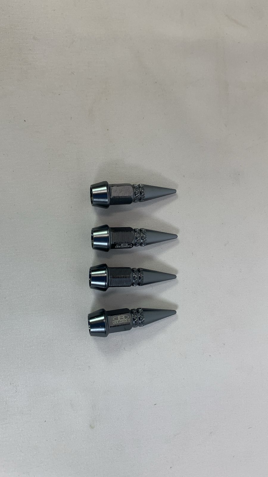Valve cap spike